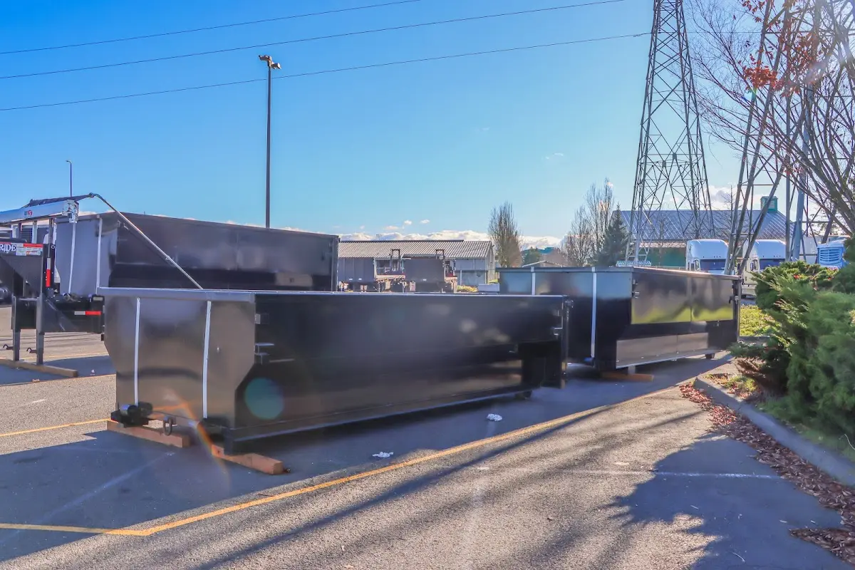 Roll-off dumpster ready for waste disposal at job site for 15 Yard Dumpster Rental in South River